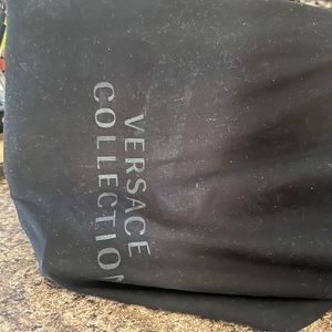 Versace Bag it’s red and it come with its own strap